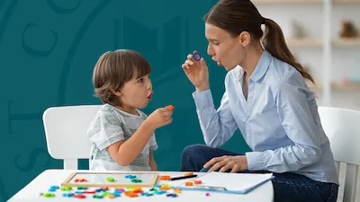 speech language pathologist working with child